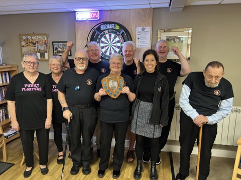 Gwyn Court Dinosaurs holding their trophy