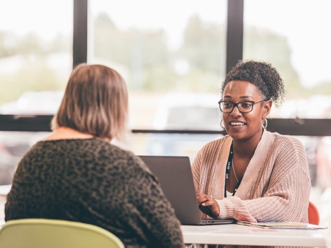 People talking over a table