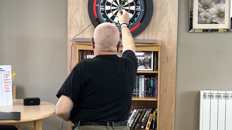 Haven resident throwing at a dart board