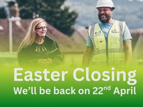 Two Tai Tarian staff members with a banner below with the headline of Easter Closing